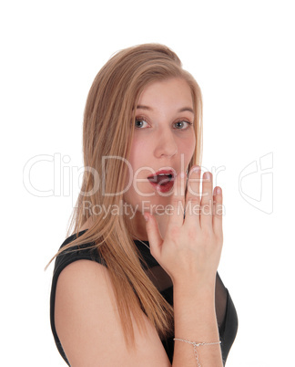 Woman telling an secret behind her hand