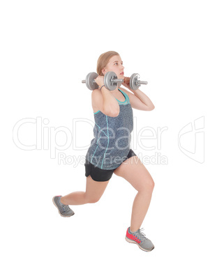 Young woman lifting her two dumbbell's