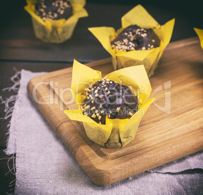 chocolate muffins on a wooden board