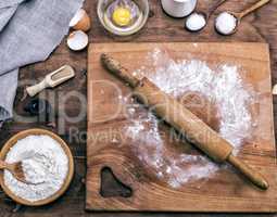 square wooden kitchen board with rolling pin