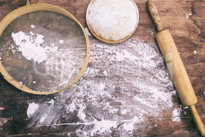 yeast dough in a wooden bowl