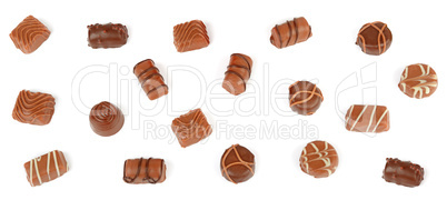 Top view of various chocolate pralines isolated on white backgro