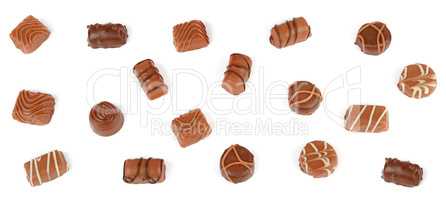 Top view of various chocolate pralines isolated on white backgro