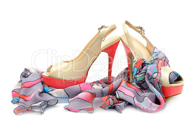Elegant sandals and scarf isolated on white background.