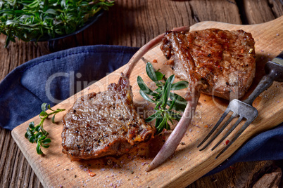 Grilled lamb chops an old board