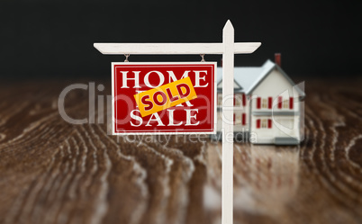 Sold For Sale Real Estate Sign In Front of Model Home on Reflect