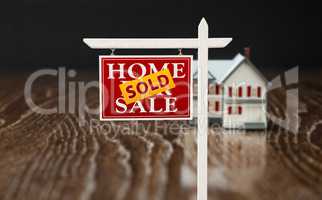 Sold For Sale Real Estate Sign In Front of Model Home on Reflect