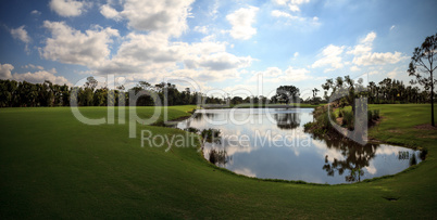 Pond and Lush green grass on a golf course