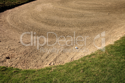Golf ball and a sand trap