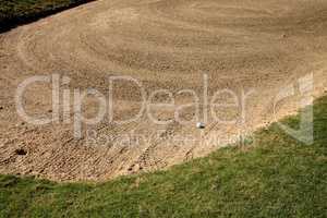 Golf ball and a sand trap