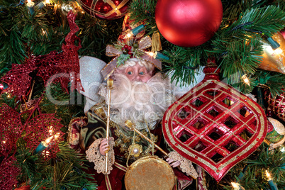 Christmas ornaments and white lights on a Christmas tree