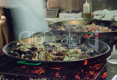 Seafood paella with shrimp, scallops, lobster and muscles