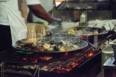 Seafood paella with shrimp, scallops, lobster and muscles