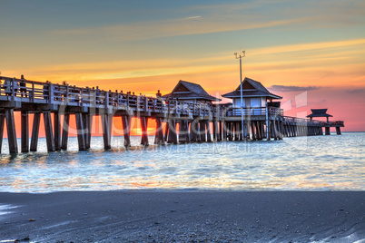 Naples Pier on the beach at sunset