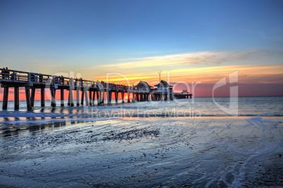 Naples Pier on the beach at sunset