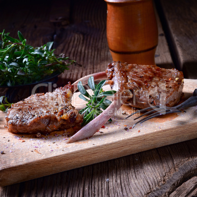 Grilled lamb chops an old board