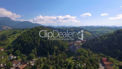 Aerial drone shot of medieval castle in the mountains