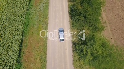 Aerial shot from top of car vehicle driving on countryside road
