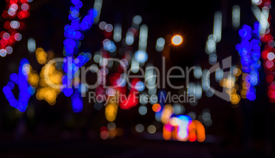 Blurred background of the street at night with luminous electric