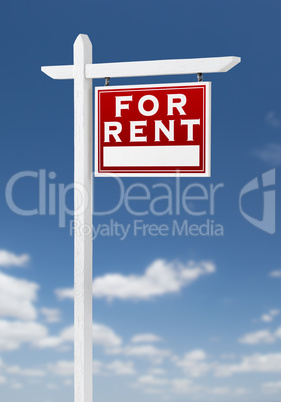 Right Facing For Rent Real Estate Sign on a Blue Sky with Clouds