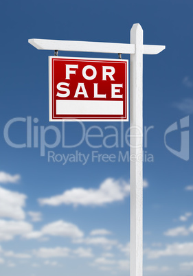 Left Facing For Sale Real Estate Sign on a Blue Sky with Clouds.