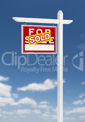 Left Facing Sold For Sale Real Estate Sign on a Blue Sky with Cl