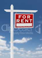 Right Facing For Rent Real Estate Sign on a Blue Sky with Clouds