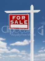 Left Facing For Sale Real Estate Sign on a Blue Sky with Clouds.