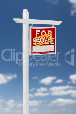 Right Facing Sold For Sale Real Estate Sign on a Blue Sky with C