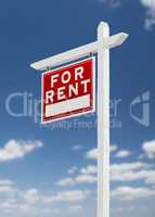 Left Facing For Rent Real Estate Sign on a Blue Sky with Clouds.