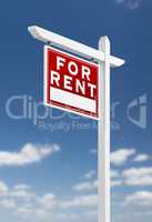 Left Facing For Rent Real Estate Sign on a Blue Sky with Clouds.