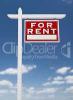 Right Facing For Rent Real Estate Sign on a Blue Sky with Clouds