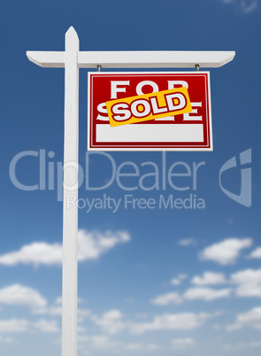 Right Facing Sold For Sale Real Estate Sign on a Blue Sky with C