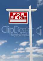 Left Facing For Rent Real Estate Sign on a Blue Sky with Clouds.