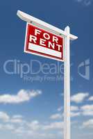 Left Facing For Rent Real Estate Sign on a Blue Sky with Clouds.