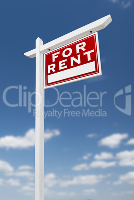 Right Facing For Rent Real Estate Sign on a Blue Sky with Clouds