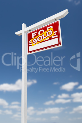 Right Facing Sold For Sale Real Estate Sign on a Blue Sky with C Right Facing Sold For Sale Real Estate Sign on a Blue Sky with C