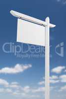 Blank Real Estate Sign Over A Blue Sky with Clouds.