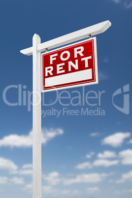 Right Facing For Rent Real Estate Sign on a Blue Sky with Clouds