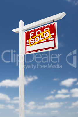 Right Facing Sold For Sale Real Estate Sign on a Blue Sky with C