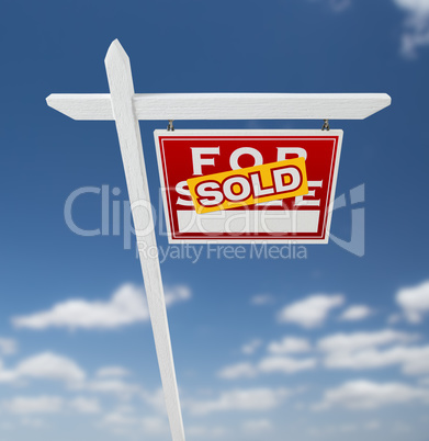 Right Facing Sold For Sale Real Estate Sign on a Blue Sky with C