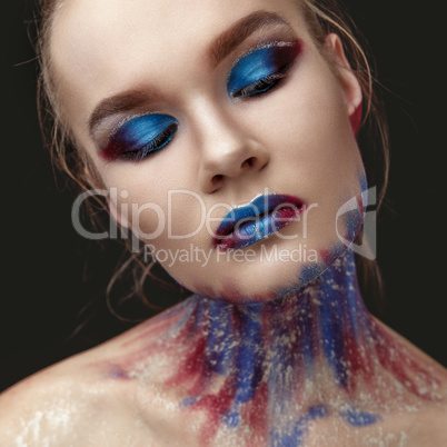 Portrait of beautiful girl with blue tones makeup