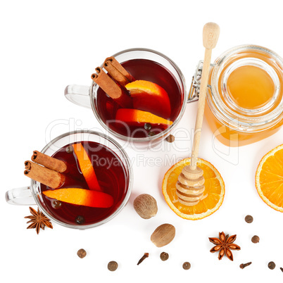 Hot red mulled wine, bee honey, slices of oranges and spices iso