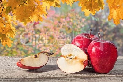 Several apples on a wooden table