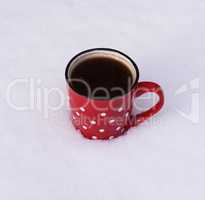 ceramic mug with white circles with black coffee