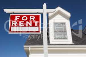 Left Facing For Rent Real Estate Sign In Front of House and Deep