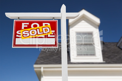 Left Facing Sold For Sale Real Estate Sign In Front of House and