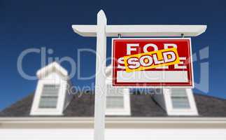 Right Facing Sold For Sale Real Estate Sign In Front of House an