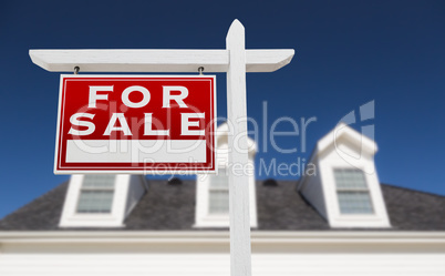 Left Facing For Sale Real Estate Sign In Front of House and Deep