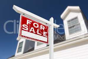 Left Facing For Sale Real Estate Sign In Front of House and Deep
